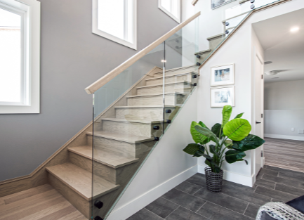 What are the advantages of using glass handrails for staircases?